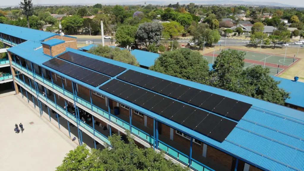 aerial view of solar panels on a school roof